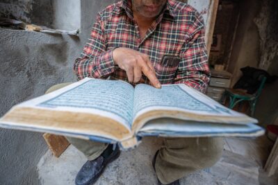 A man holds a Qur’an