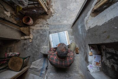 The man reads the Qur’an